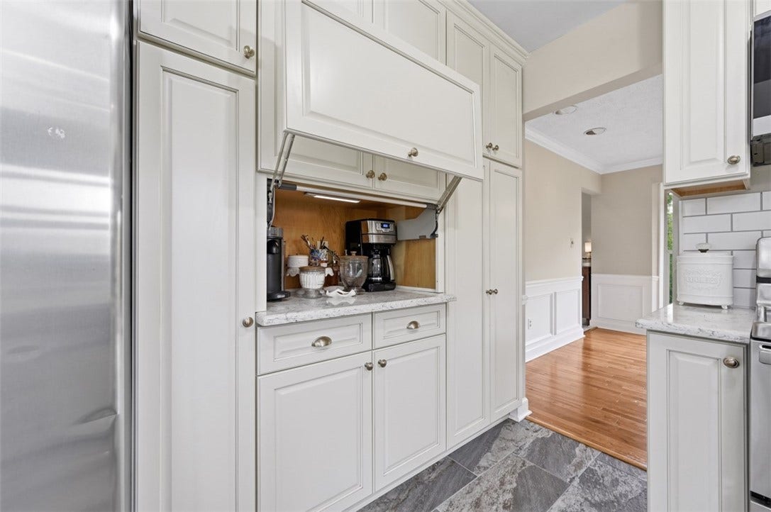 Convenient appliance garage easily tucks away for a seamless look