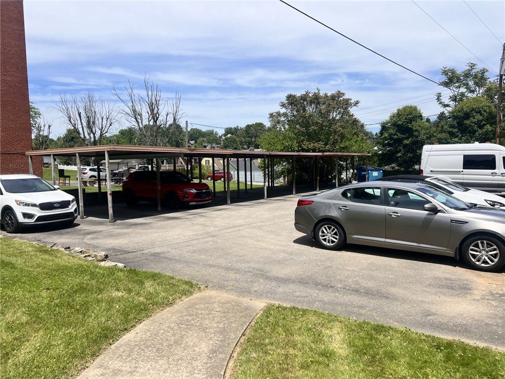 Seller does own 1 of the covered parking spots