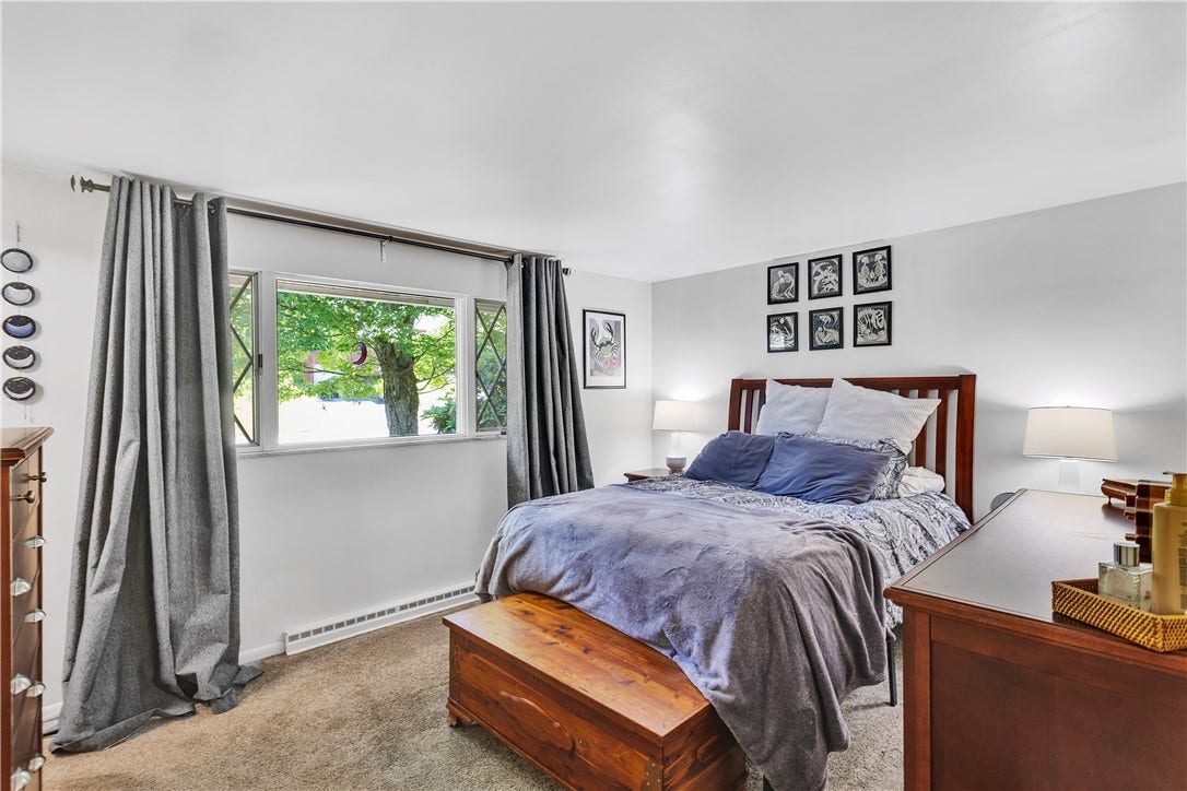 Front Facing Primary BR with Picture Window, Neutral Carpet/Paint, and en Suite Private Bath.