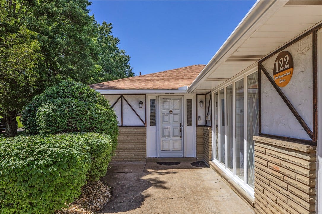 Concrete Drive Leads to Level Walkway into the Home.