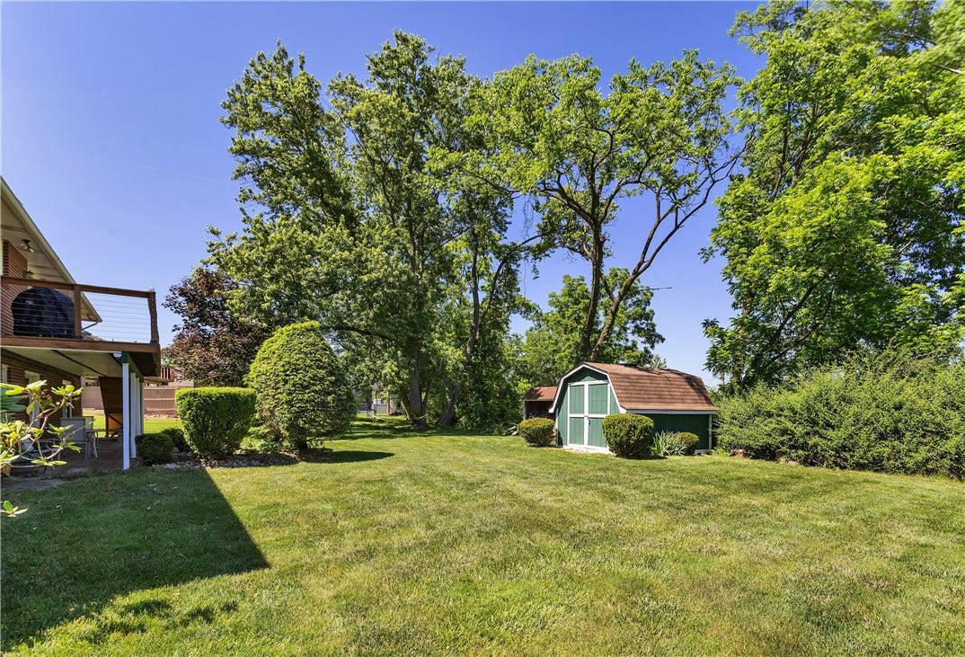 Wonderful Level Yard with Large Storage Shed.