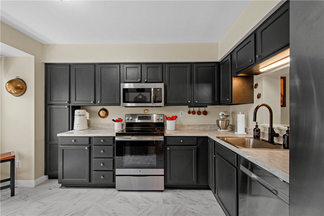 Nice sized eat-in kitchen with ample cabinets & counters
