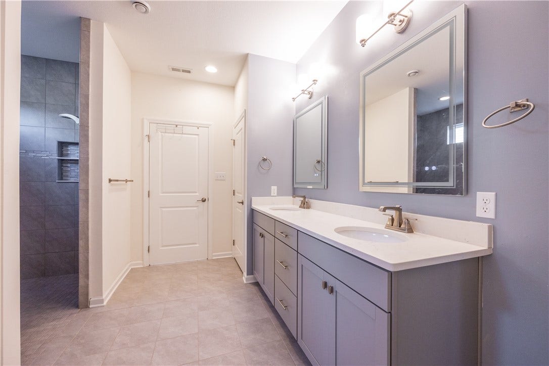 Master Bath with walk in shower and double sinks.