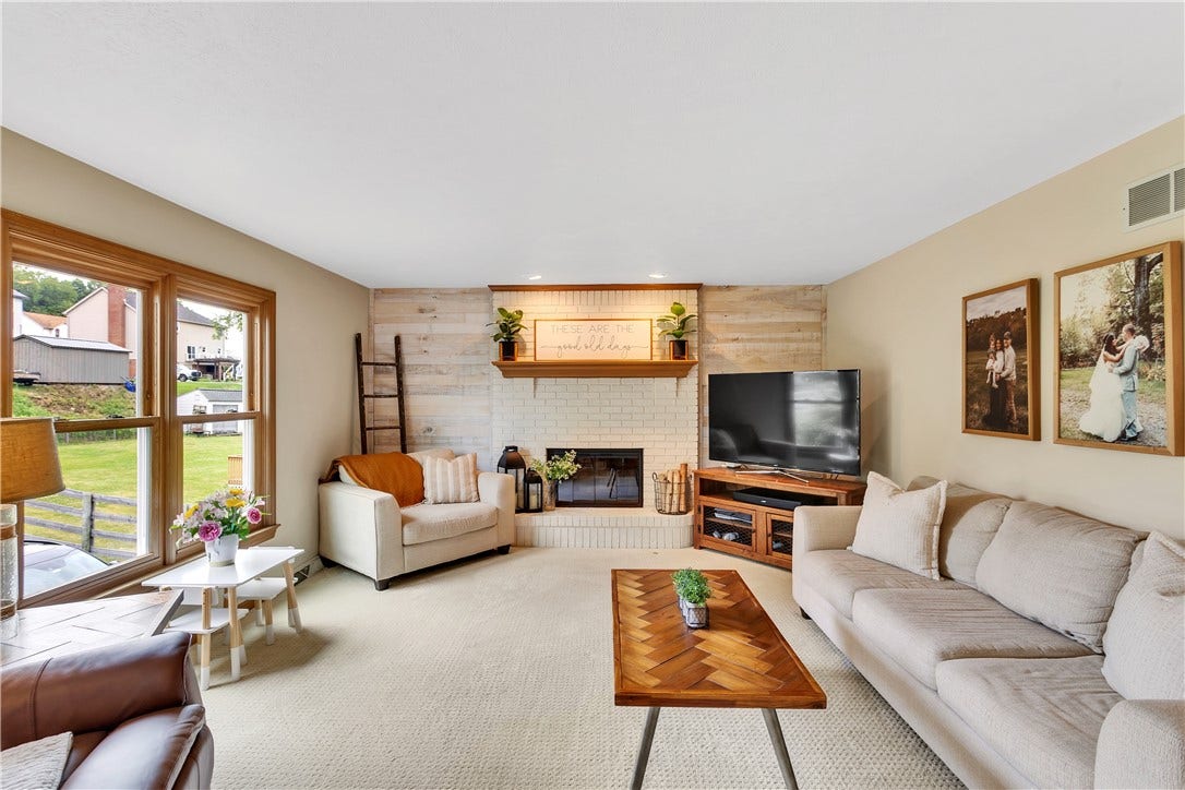 16x14 with Wood Accent Wall and White Bricked Fireplace - Gas or Wood Burning.