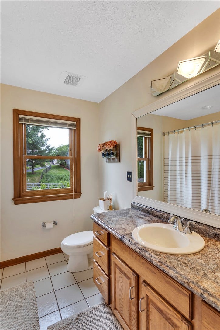 3 Sarah Ct., Irwin, PA 15642 Hallway Bath with Large Vanity, Tile Floor and Tub/Shower Combo.
