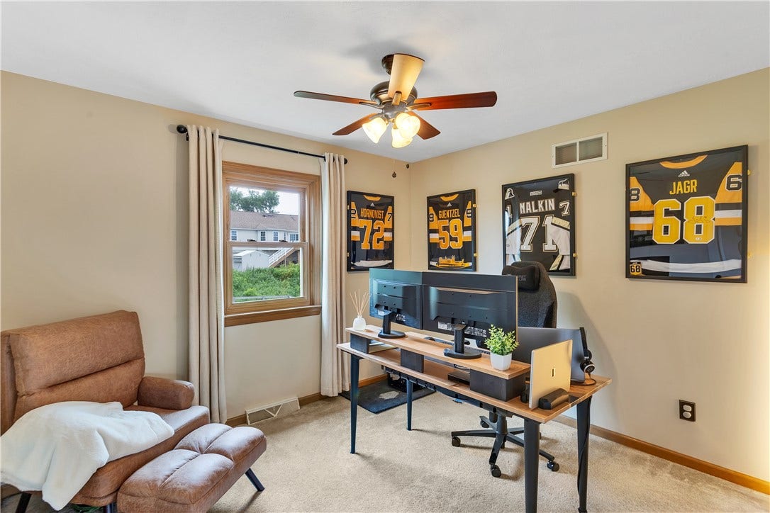 11x10 Spacious 4th Bedroom with Ceiling Fan, Neutral Carpet and Paint. Currently used as a Home Office.