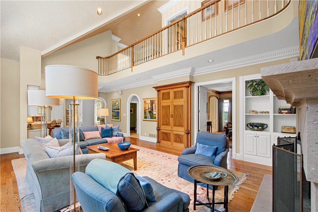 This view  shows the 2nd floor balcony hallway. Note the recessed custom built in entertainment cabinet featuring europen walnut, zebra wood and african wenge details.