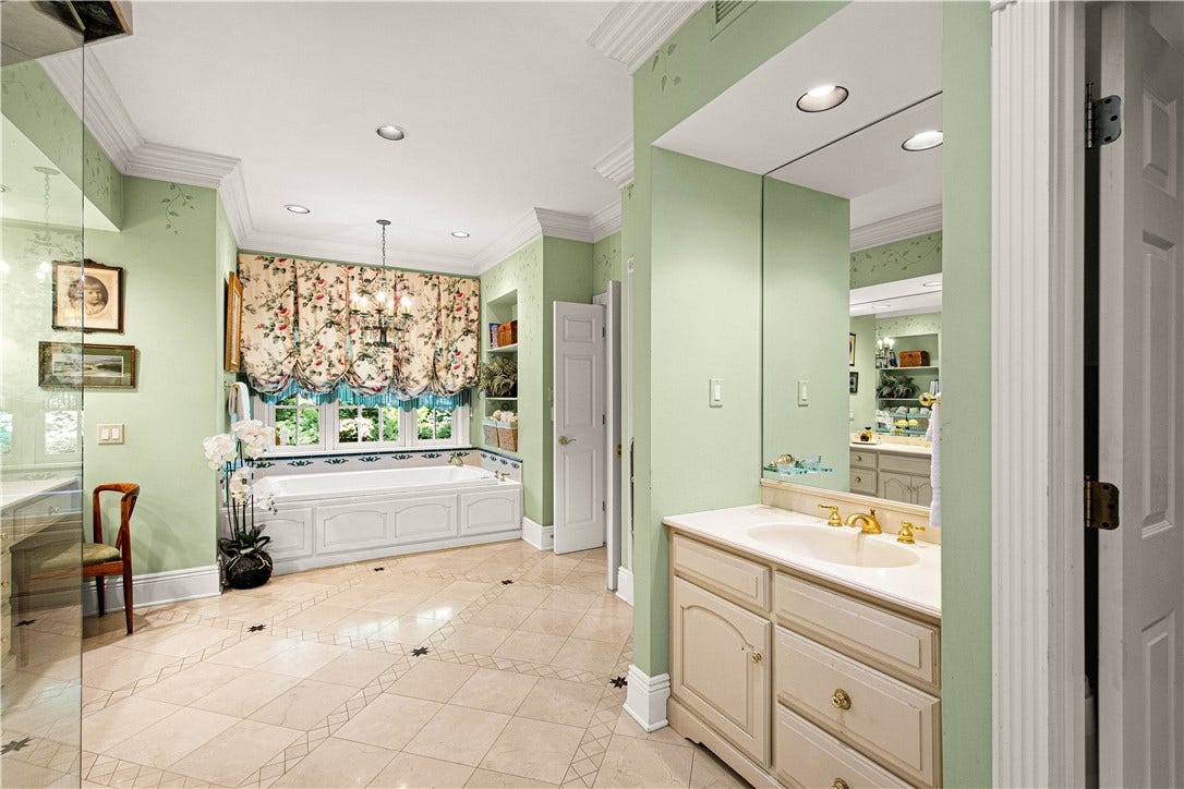 A tub with garden views! Just out of sight are two walk in closets.