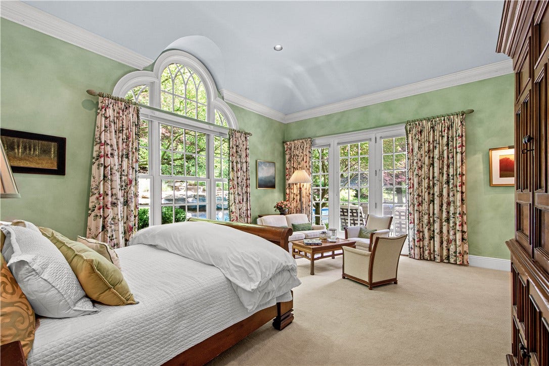 Wake up to a view!  The Primary Bedroom also provides access to the backyard patio.