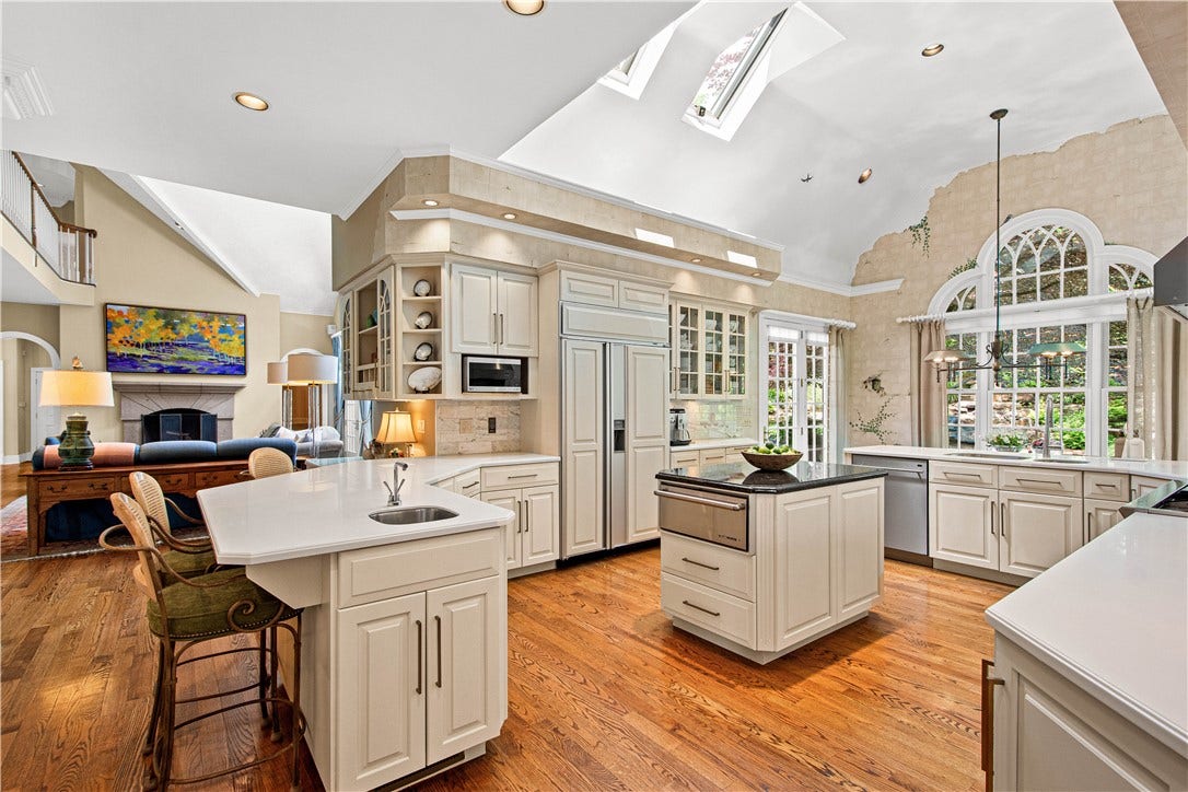 The Kitchen is the heard of the home! Custom Elish Cabinetry and Thermador, Viking and Subzero appliances, Dual ovens and a warming drawer. Beautiful Corian and Granite counters and marble backsplash.