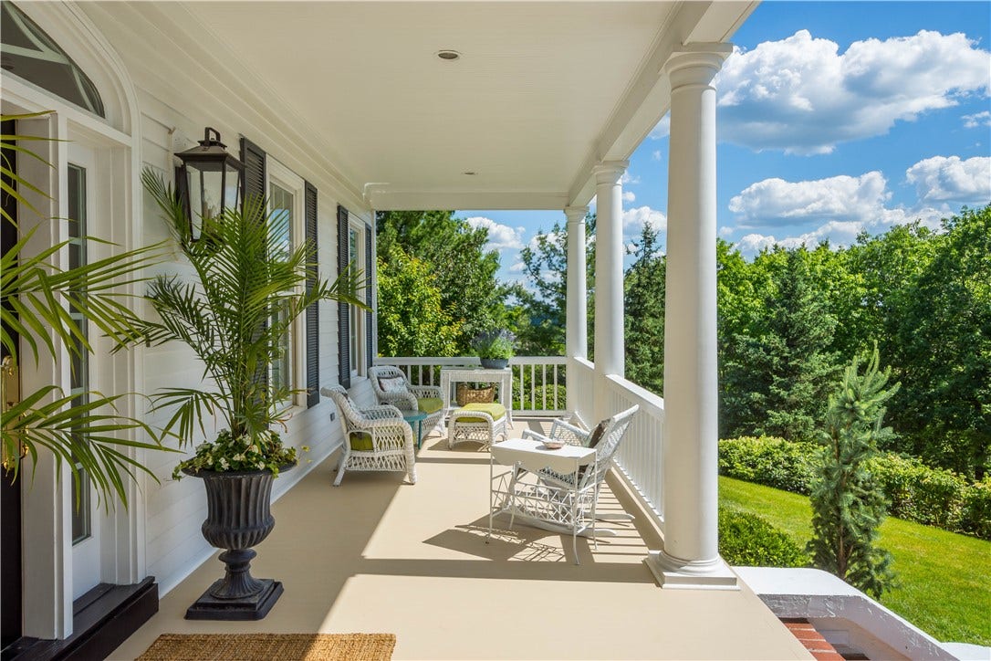Gorgeous 50 foot porch redesigned in 2026 with premium PVC decking.