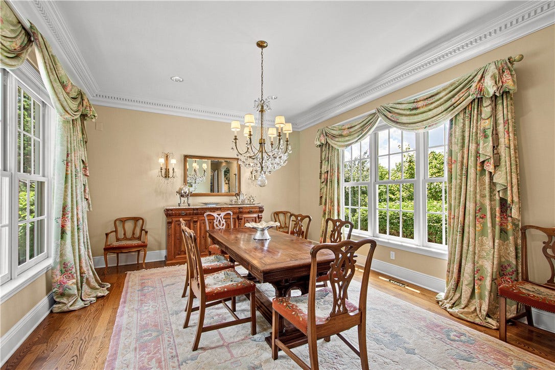 Conveniently located between the Living Room and Kitchen, the Dining Room offers both views of the gardens and pool in the backyard as well as the view of rolling hills in the front.