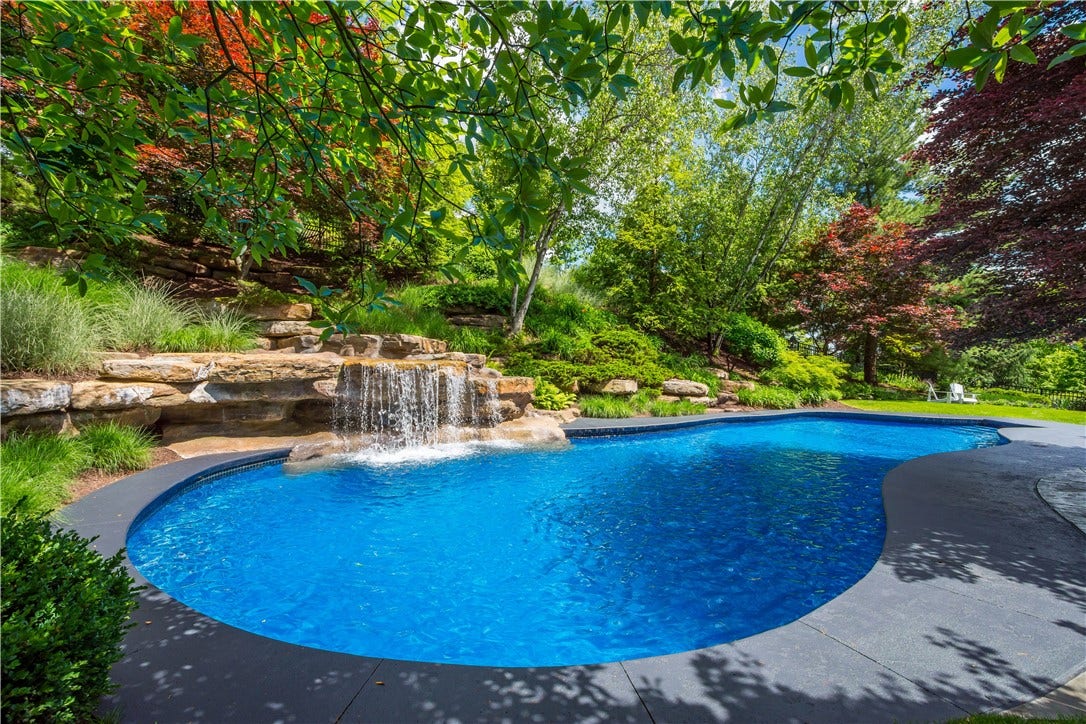 Just breathtaking! Custom designed pool and waterfall by Mike Hodak, Falling Water Construction.