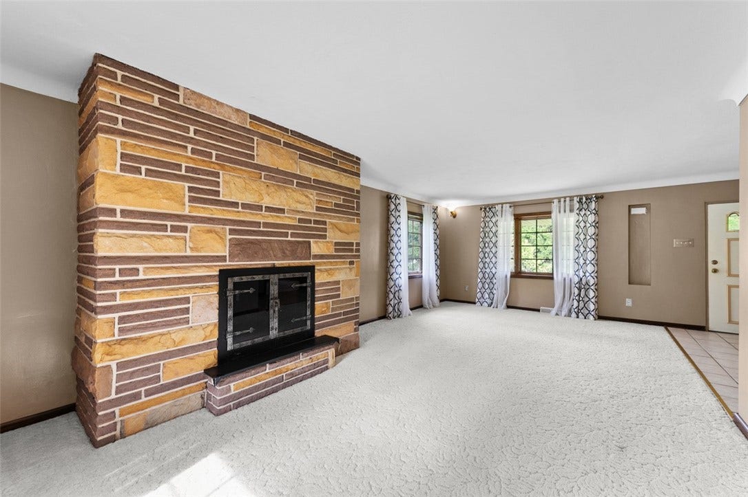 Log Stone faced Fireplace in Living Room