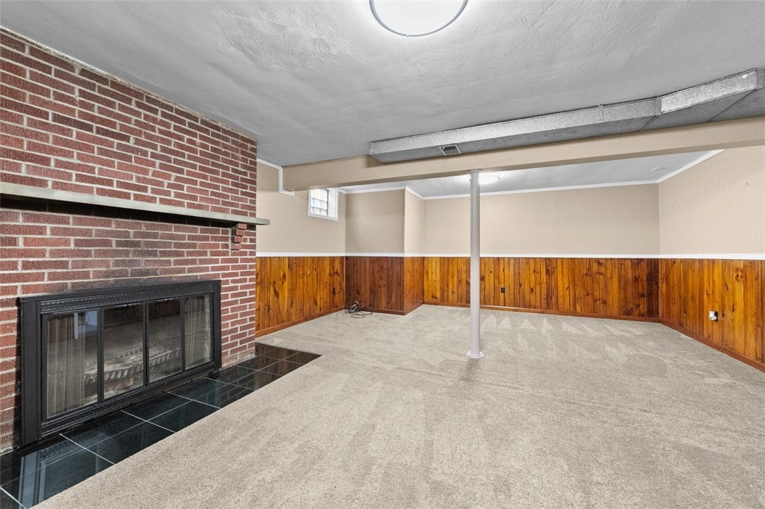 Lower Level Game room with Log Fireplace