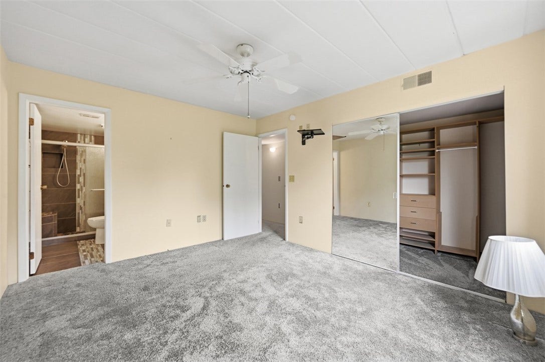 1400 Smokey Wood Dr, #601, Pittsburgh, PA 15218 Primary bedroom is spacious with walk-in closet and updated bathroom.