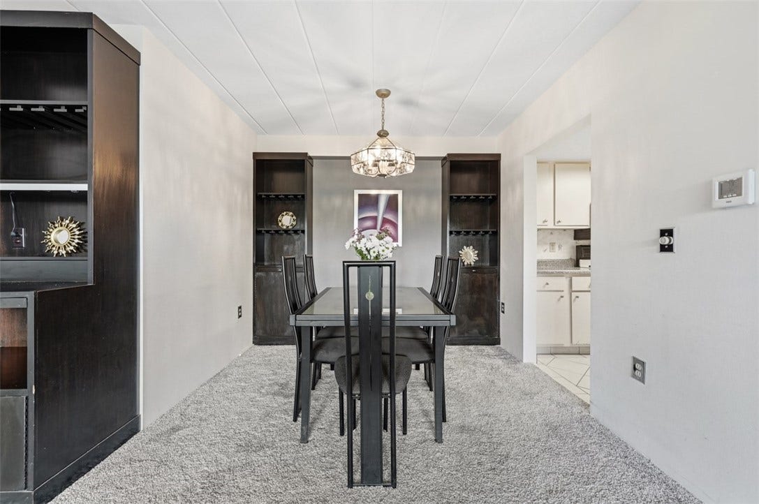1400 Smokey Wood Dr, #601, Pittsburgh, PA 15218 Dining room comfortably accommodates an 810 compact seat dining table and features a custom-built cupboard with thoughtfully designed storage and display details.