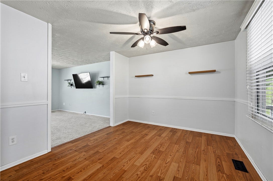 Lighted ceiling fan.