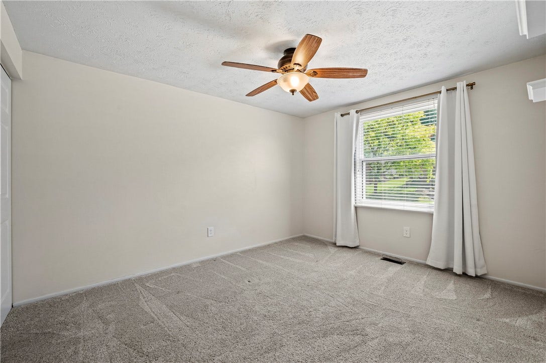 Lighted ceiling fan.