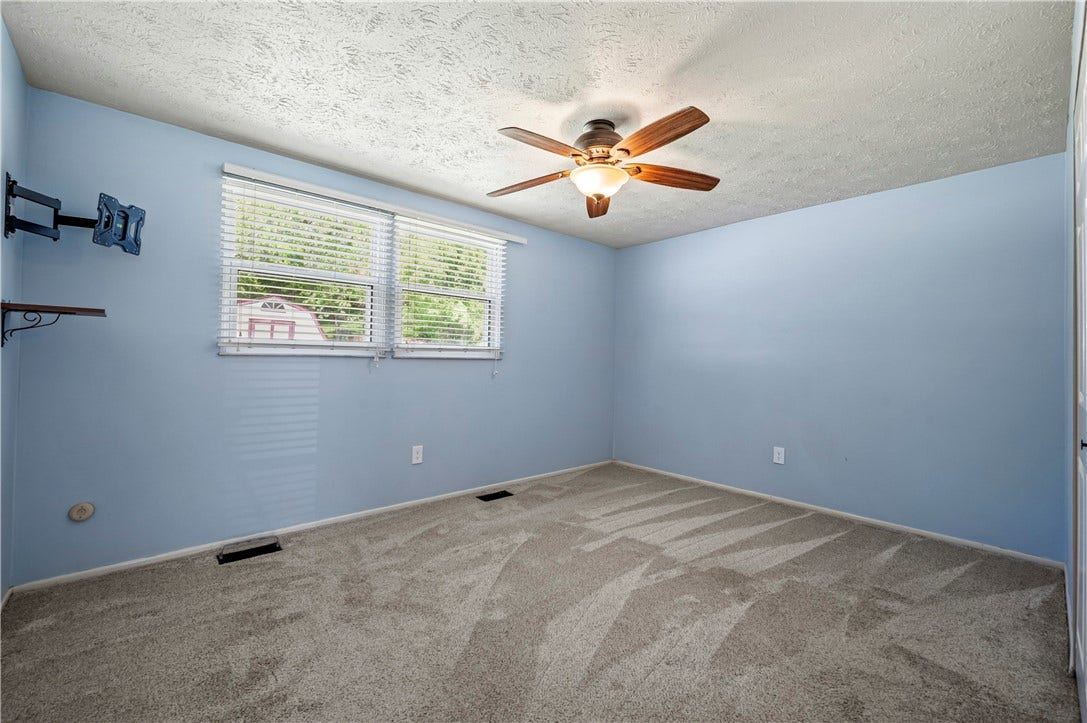 Lighted ceiling fan.