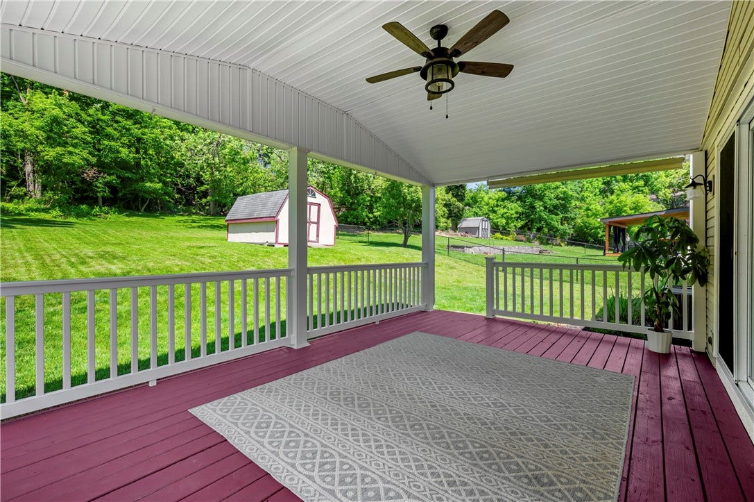 Railing and lighted ceiling fan.