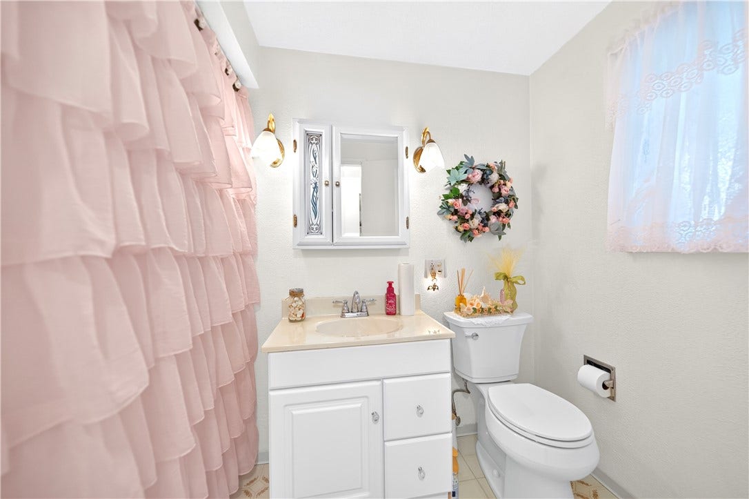 The full bathroom is located on the main floor right next to the primary bedroom.