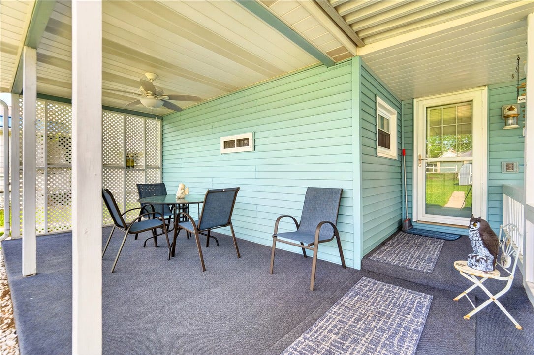 This covered back patio will make outdoor dining so easy and convenient!
