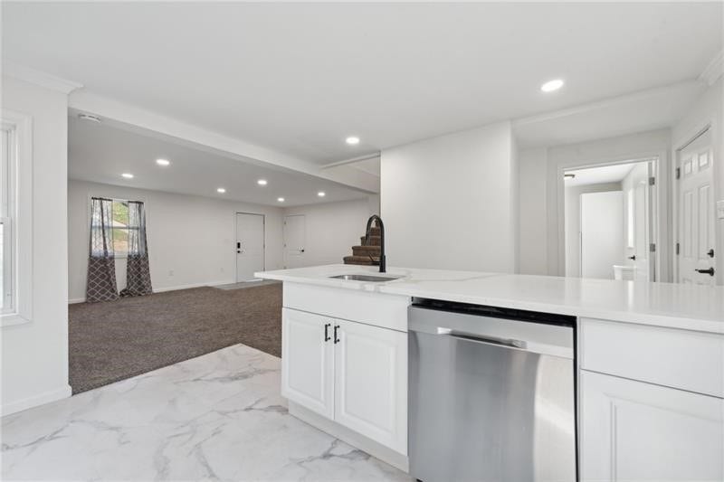 Another view of the kitchen looking into living area.
