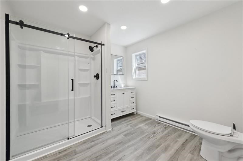 Upstairs full bathroom with walk in shower.