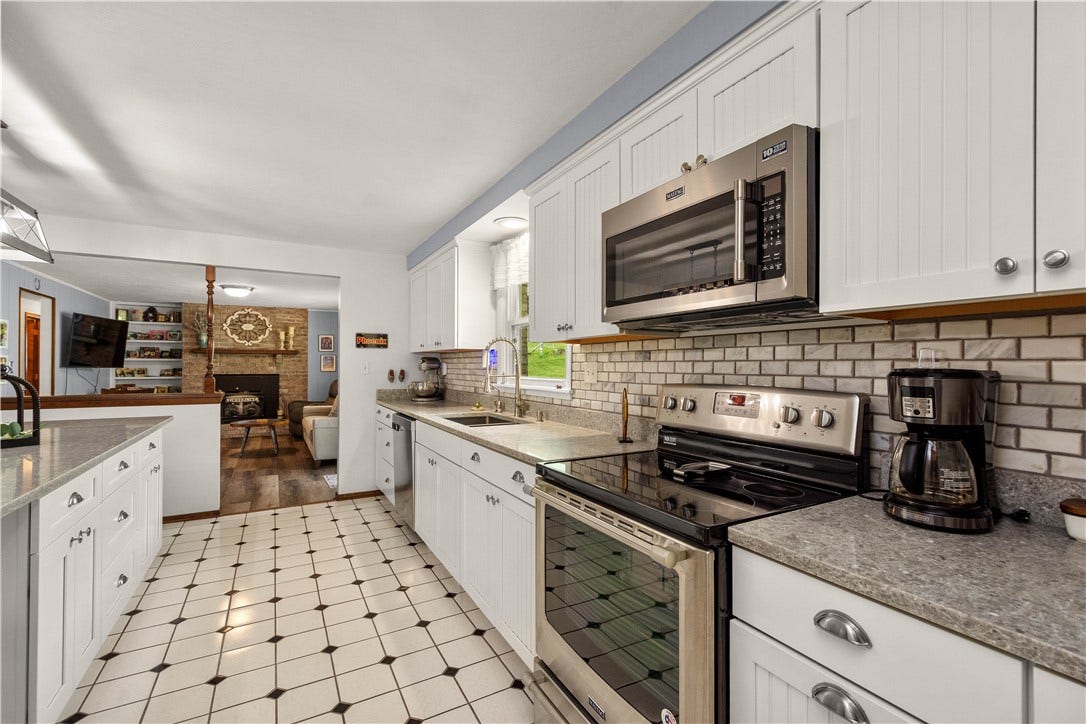 Beautiful tiled backsplash and granite counters.