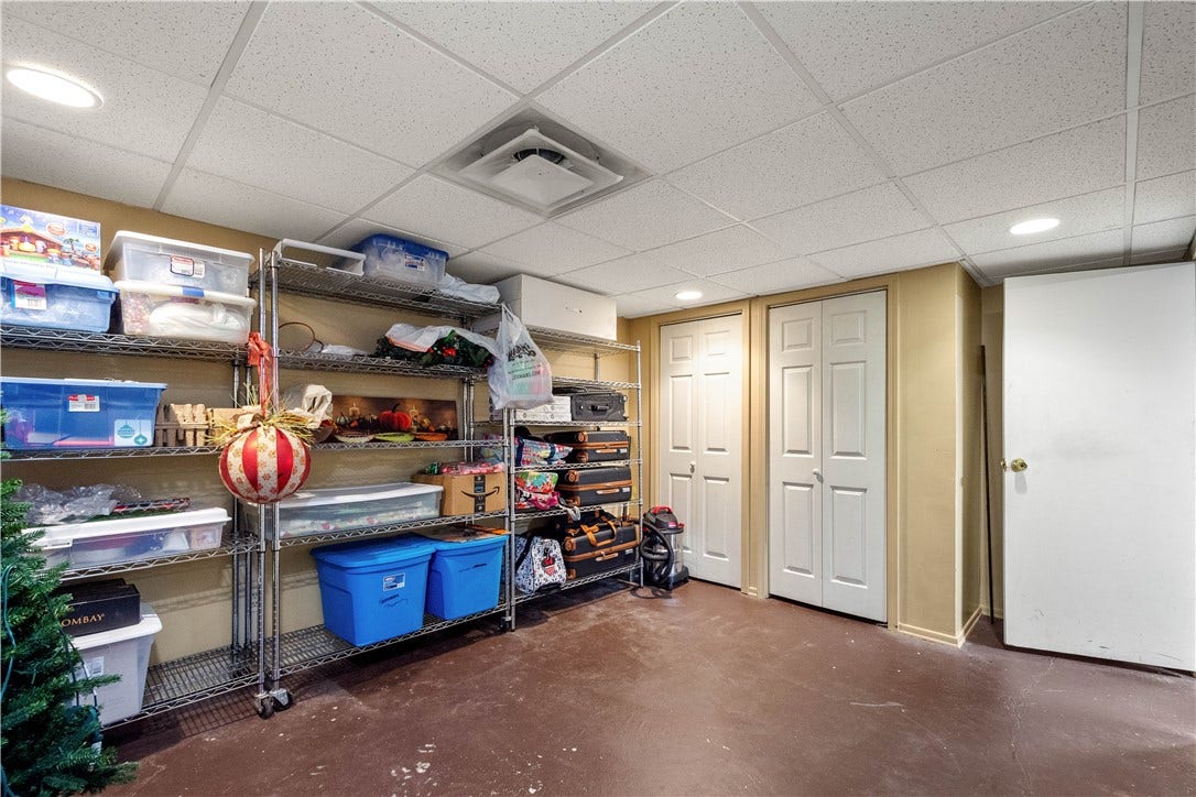 Large room with double closets in basement. Just add flooring.
