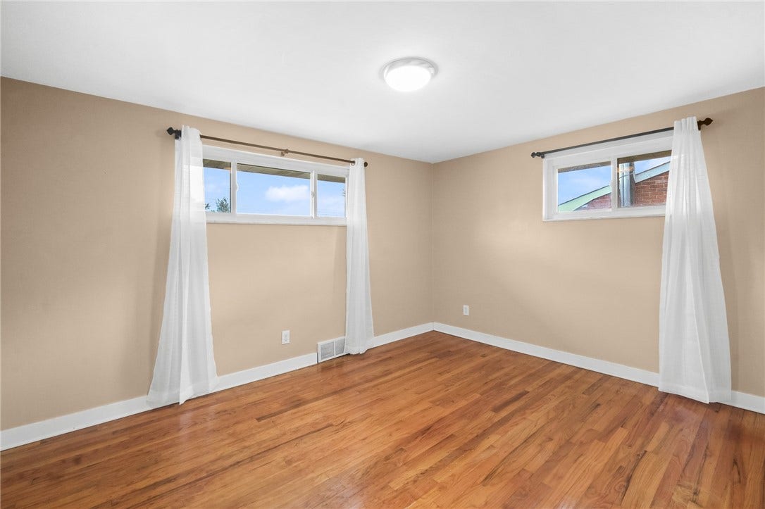 14 x 10 primary bedroom features hardwood floors and large closet.