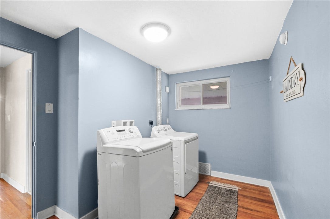 Sellers created a 1st floor laundry from the smallest bedroom. If desired, the laundry can be moved back to basement and returned to a bedroom or office. Washer/dryer included in sale.
