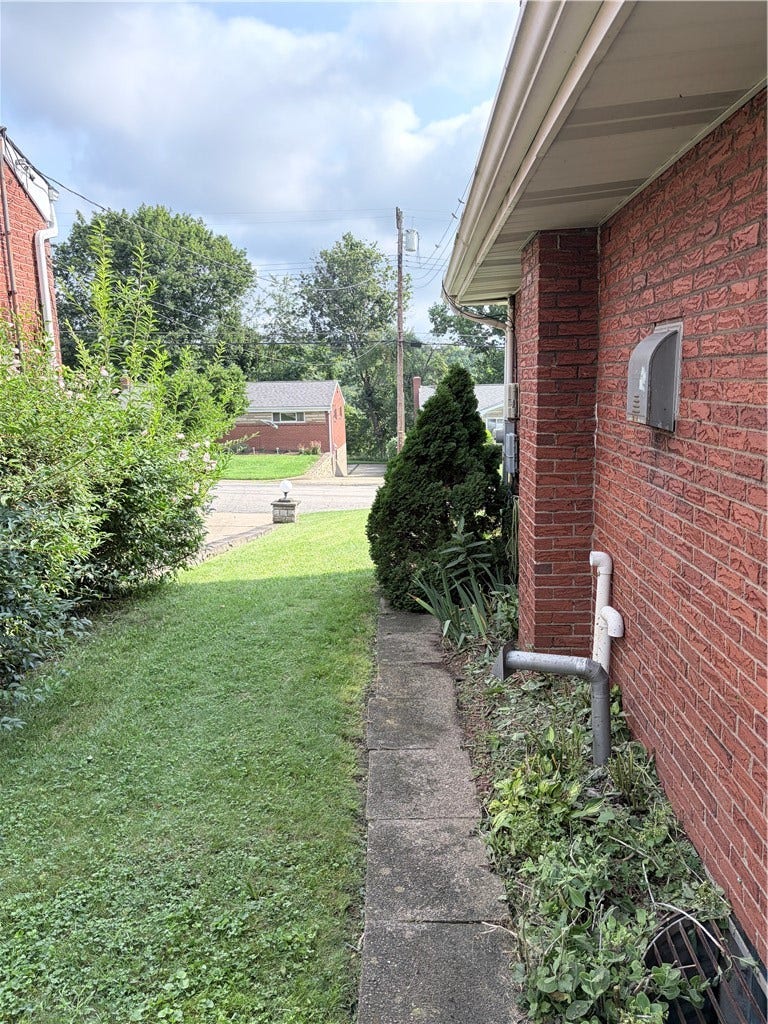 Walkway on the right side of home.