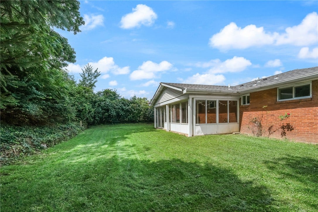 Wooded slope in rear yard provides beautiful views and privacy!