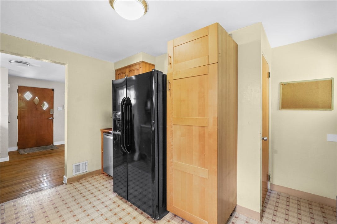 The dishwasher is next to the refrigerator in this photos. Sellers wisely added plumbing and a dishwasher for your convenience!