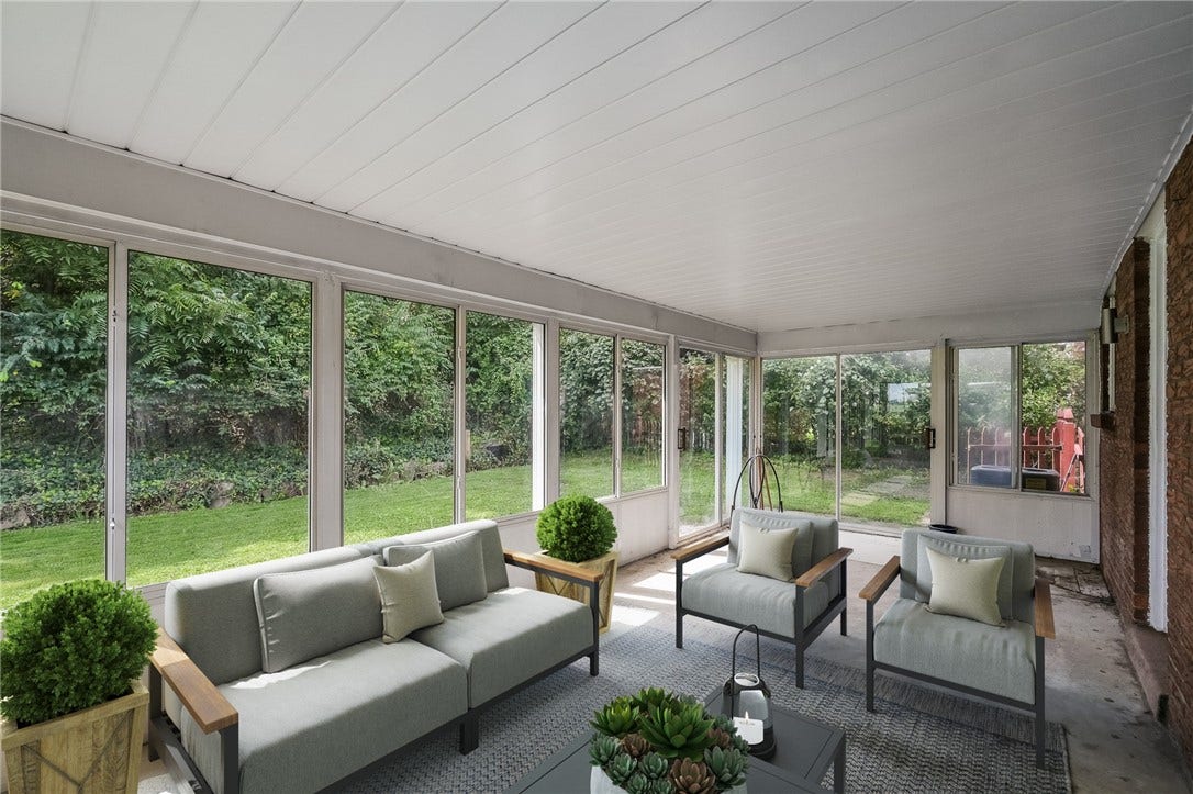 Imagine relaxing in this spacious sunroom!