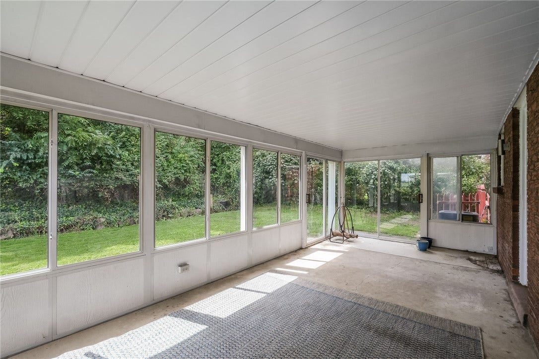 Imagine relaxing in this spacious sunroom!