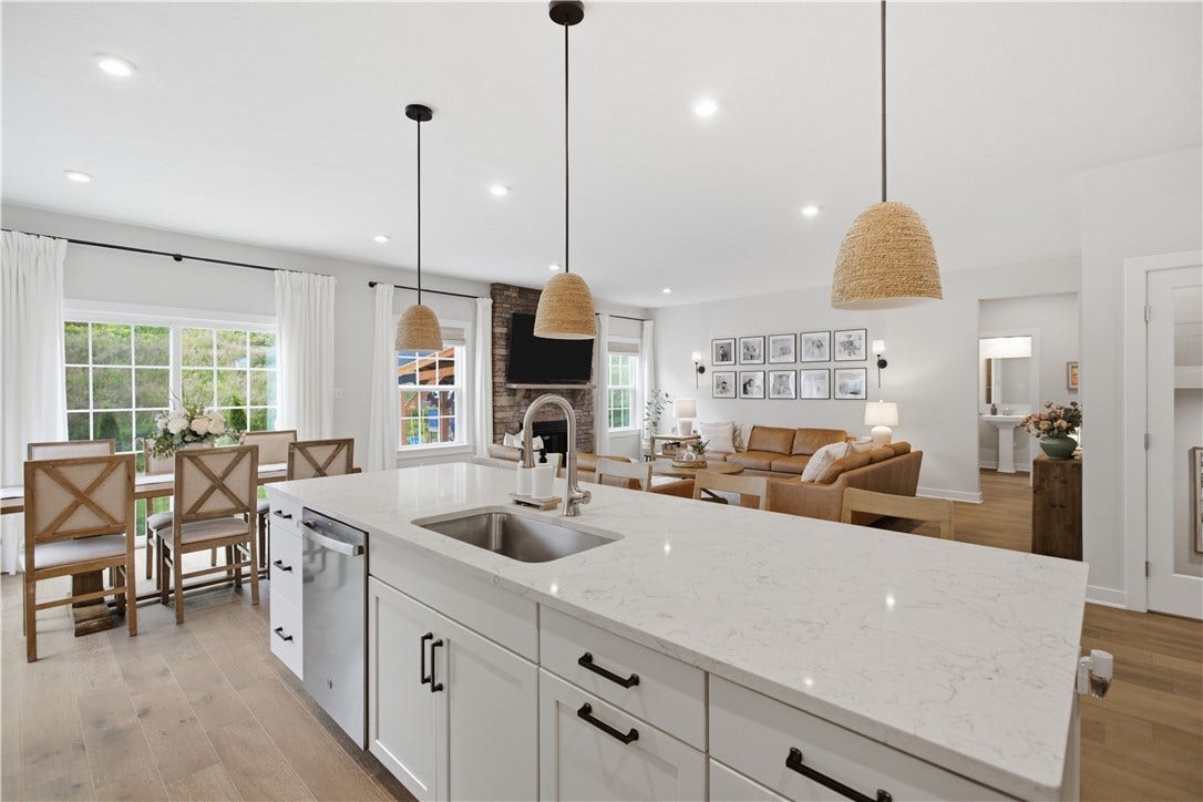 Open-concept kitchen seamlessly connects to dining area, perfect for entertaining and everyday family living.