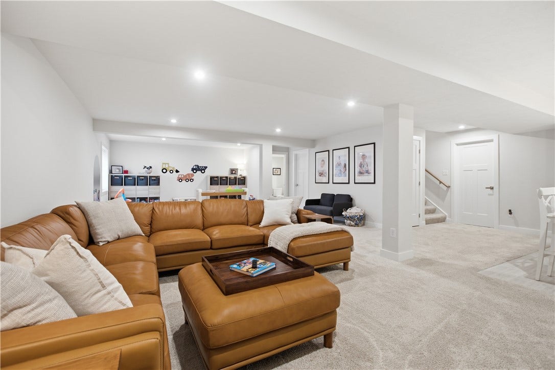 Oversized finished lower level offers exceptional versatility with multiple gathering areas, abundant square footage, and an open, flowing layout.
