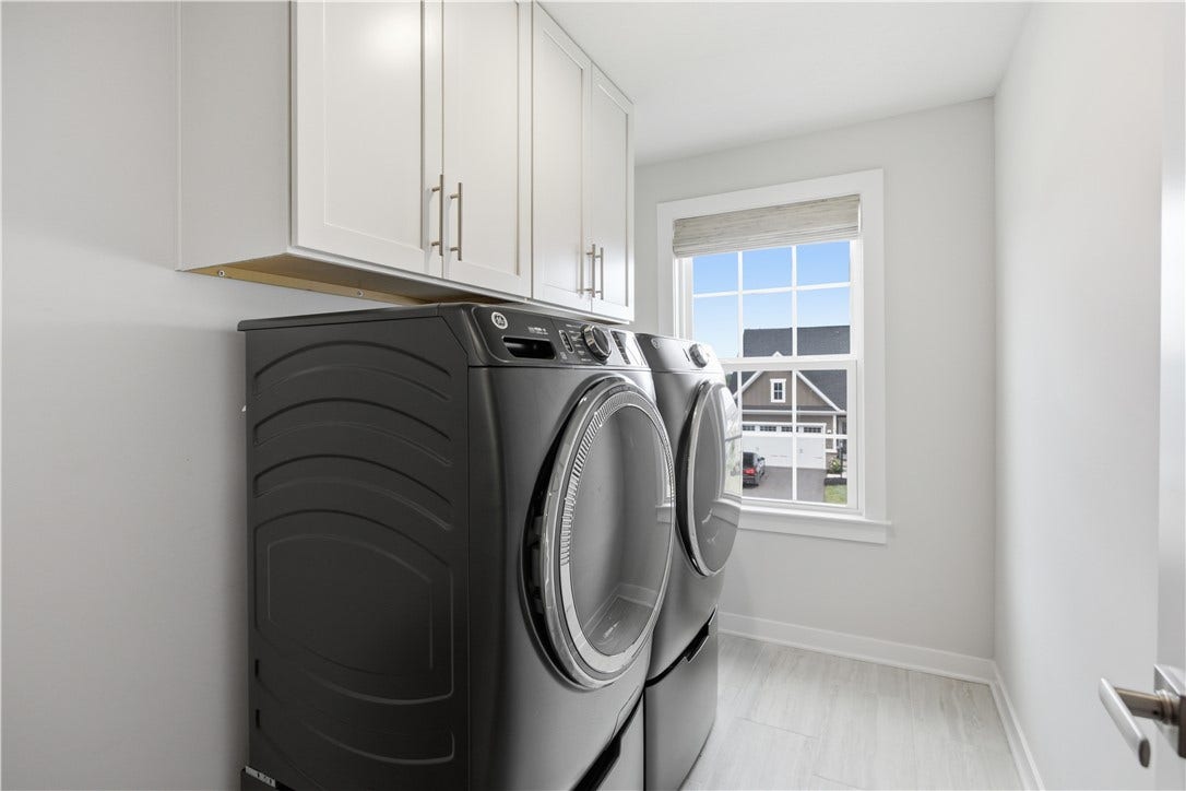 Conveniently located laundry on upper level with bedrooms.