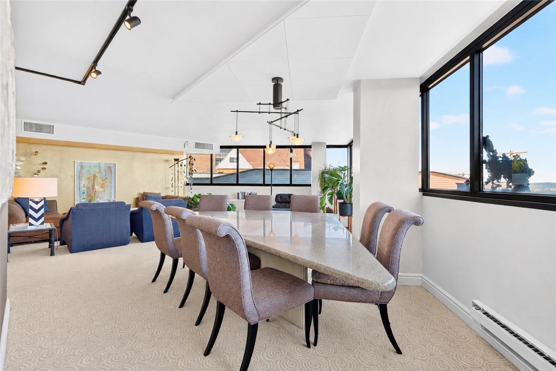 1 Trimont Ln, #490E, Pittsburgh, PA 15211 Spacious 20'15' Dining Room opens seamlessly to the Living Rooman impressive layout for entertaining, enhanced by abundant natural light and walls of windows.