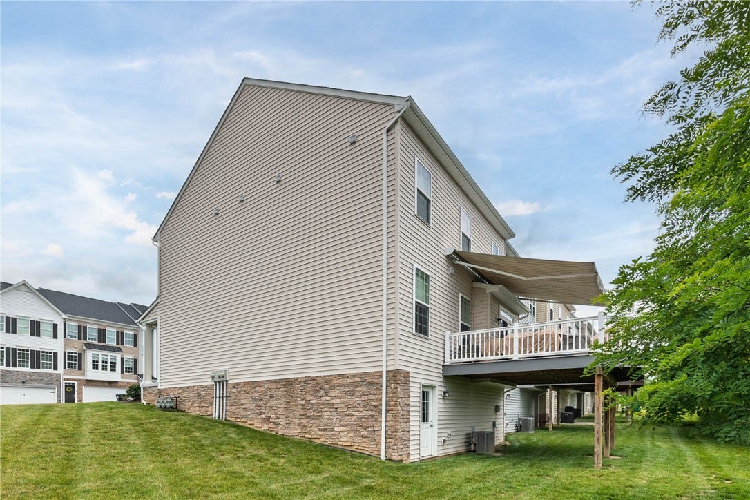 Nice view of side yard and walk out lower level.