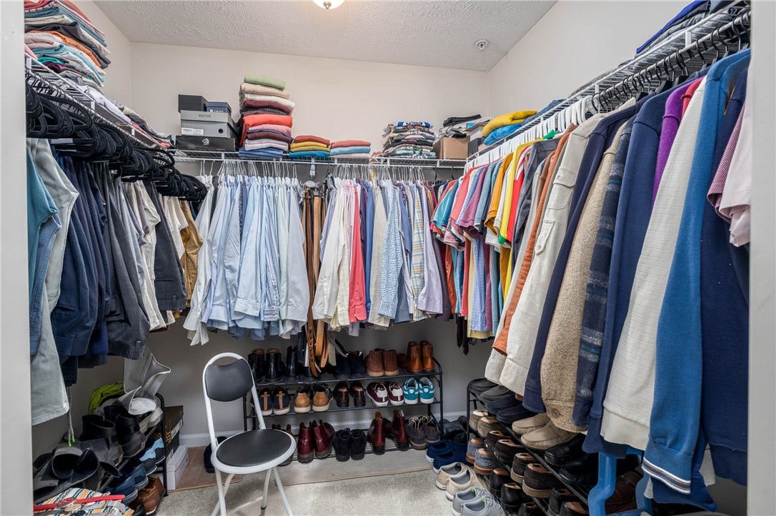 Primary bedroom walk-in closet.