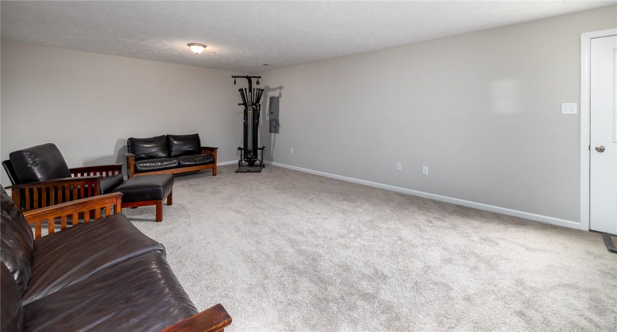 Minimally used gameroom...this room fits many needs! Mancave, womencave, exercise, craft...