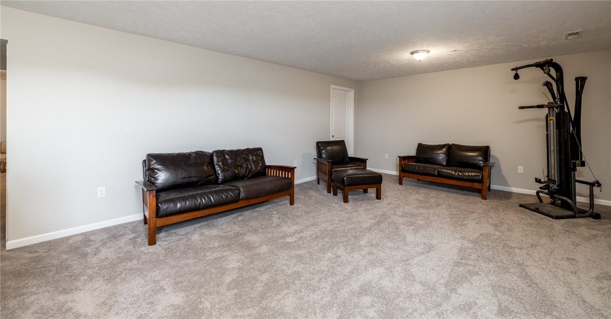 Huge gameroom is the perfect getaway...walk right out to your backyard.