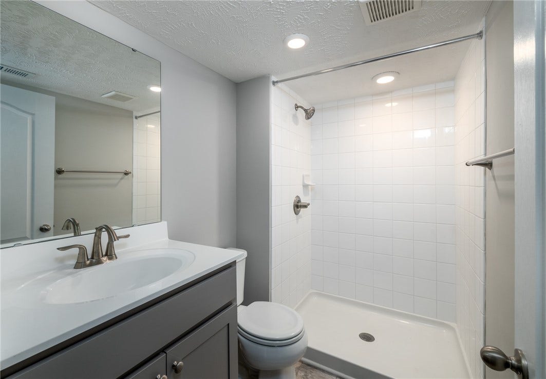 Lower level full bath with walk in shower.