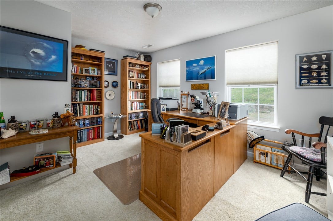 Nice size bedroom that is currenty being used as an office.