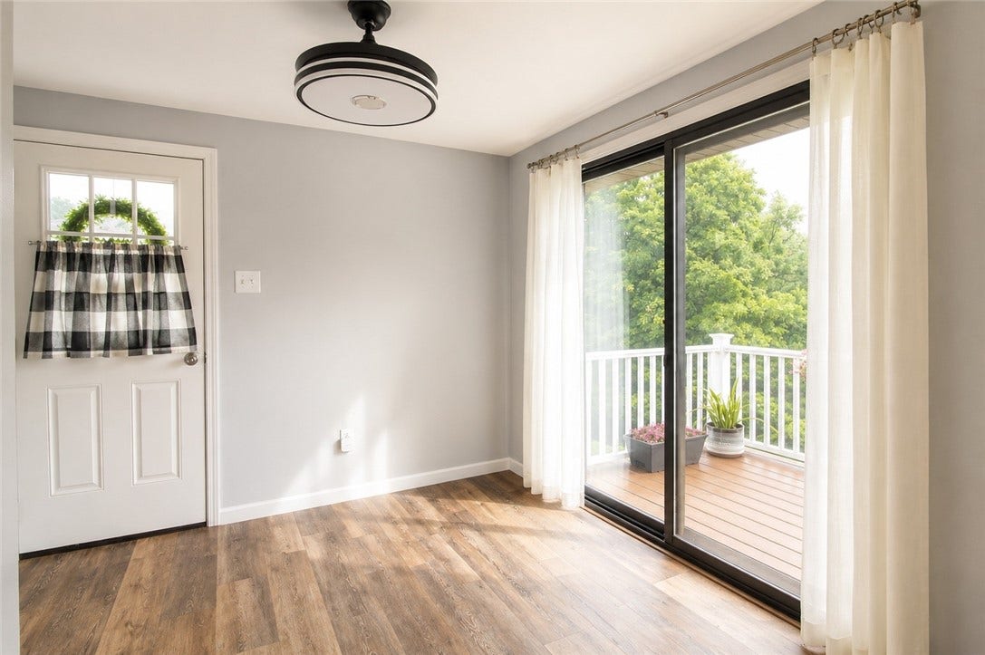 Light and bright with door to side yard and slider to deck.