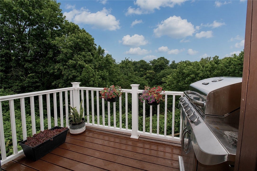 Beautiful deck overlooking the private woods and back yard.
